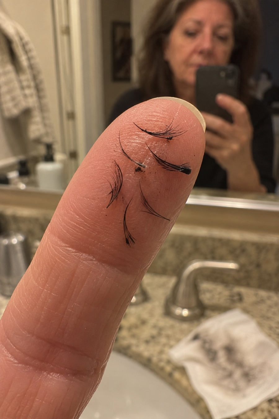 Scrubbing it off pulls lashes