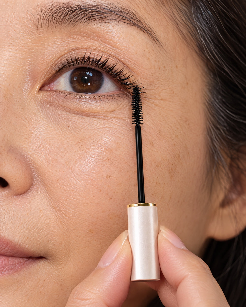 Turn the micro-wand's tip to sweep up the corner lashes.
